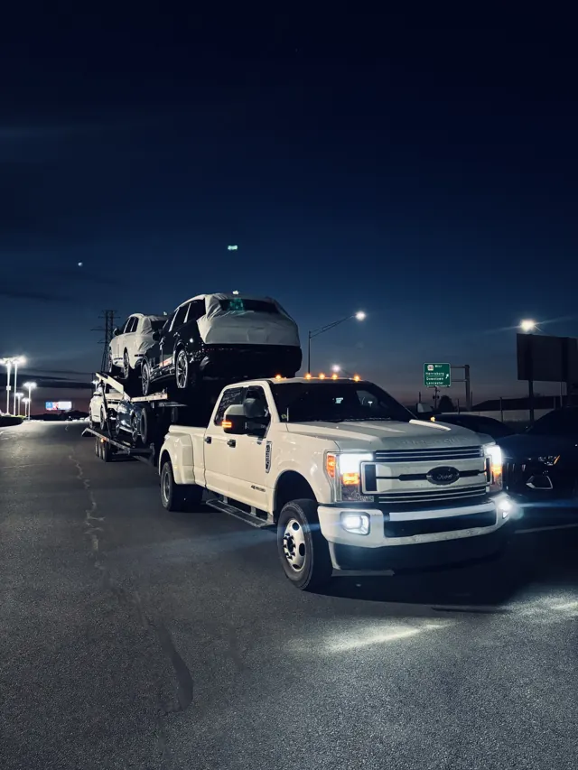 Loaded car hauler at dusk